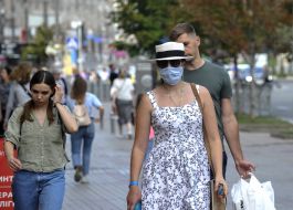 Woman in a medical mask and hat