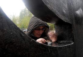 Woman lights a candle