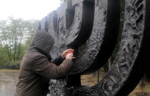Woman lights a candle