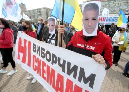 Protesters hold posters