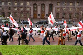 Protesters unfurled the national white-red-white flag of Belarus