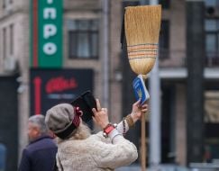 Woman with a broom and the Constitution of Ukraine