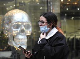 A woman in a medical mask