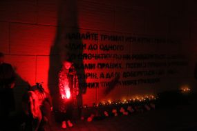 Light bulbs near the mural with a quote from activist Kateryna Gandziuk