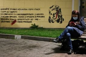 A mural with a portrait of activist Kateryna Gandziuk and a quote from her speech