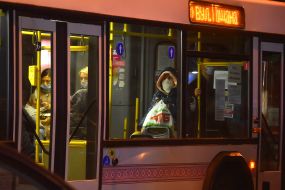 Passengers in medical masks on the bus