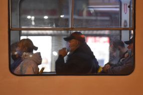 Passengers in medical masks on the bus