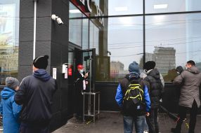 People near fast food restaurant "KFC"