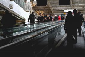 Buyers on the escalator in the shopping center "Epicenter"