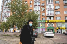 Woman in a medical mask on the street