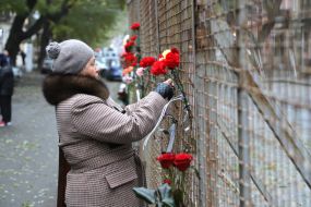 On the anniversary of the tragedy, people brought flowers to Odessa College