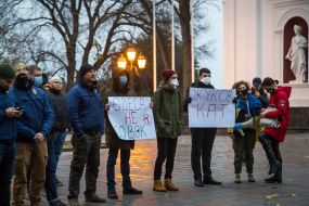 Protesters hold posters