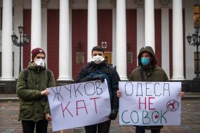 Protesters hold posters