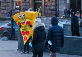 Animator in a suit of a slice of pizza