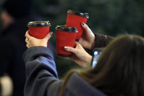 Girls holding glasses of mulled wine