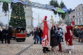 Animators dressed as Santa Clauses