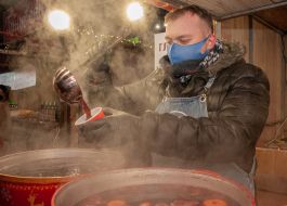 Young man selling mulled wine