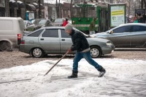 The man clears the snow