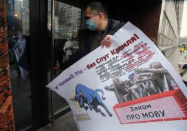 The participant of the action holds a symbolic card