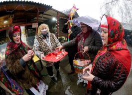 A group of carolers with a Christmas star