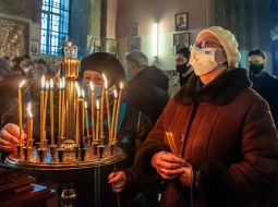 Parishioners light candles