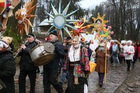 Christmas carolers with a Christmas star