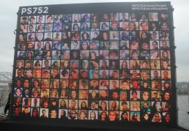 Wall with photos of dead passengers and crew of UIA flight PS752 in the sky over Tehran