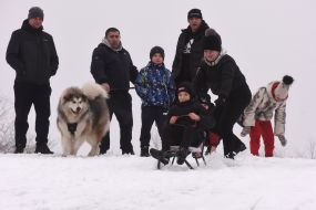 The boy is sledding