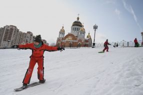 Boy riding snowboard