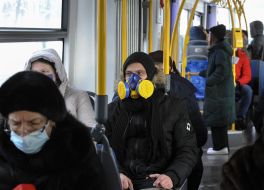 A young man wearing a respirator