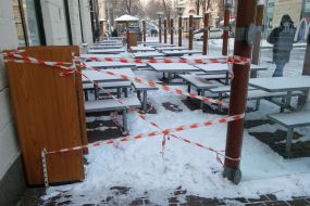 EnEnclosing signal tape at tables in McDonalds fast food restaurant