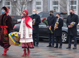 Laying flowers at the monument to Mikhail Hrushevsky