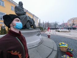 Laying flowers at the monument to Mikhail Hrushevsky