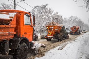 Snow removal equipment clears the road