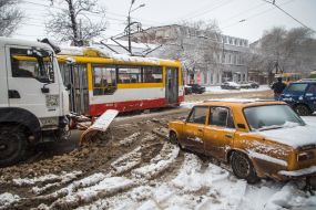 Snow removal equipment clears the road