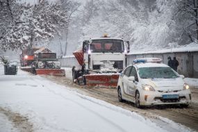 Snow removal equipment clears the road