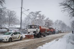 Snow removal equipment clears the road