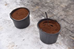 Coffee grounds in buckets