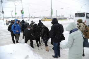 People cross a snowy road