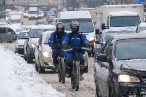 Cyclists in helmets on the road