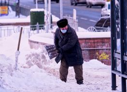 A man is shoveling snow