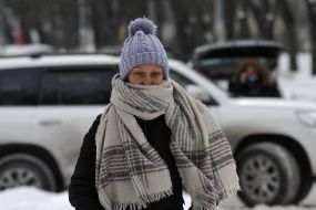 A woman wrapped in a scarf on the streets of Kiev
