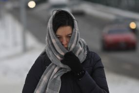 A woman wrapped in a scarf on the streets of Kiev