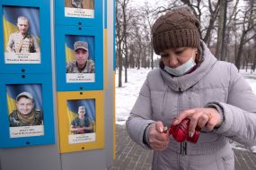 People near the memorial to the defenders of Ukraine