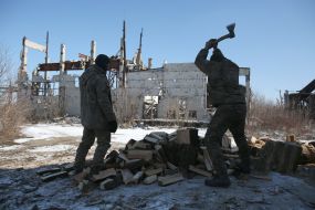 Ukrainian servicemen cut firewood