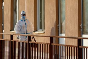 Infectious disease doctor in a protective suit on the territory of the Regional Clinical Infectious Diseases Hospital in Uzhgorod