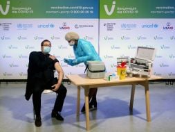 Andriy Yurash receives a vaccination from COVID-19
