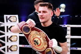 Denis Berinchik holds the championship belt