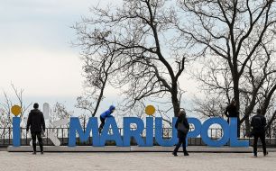 People walk in the park in Mariupol