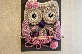 Panel with Easter eggs in the form of an owl on the wall at the exhibition "Easter Miracle"